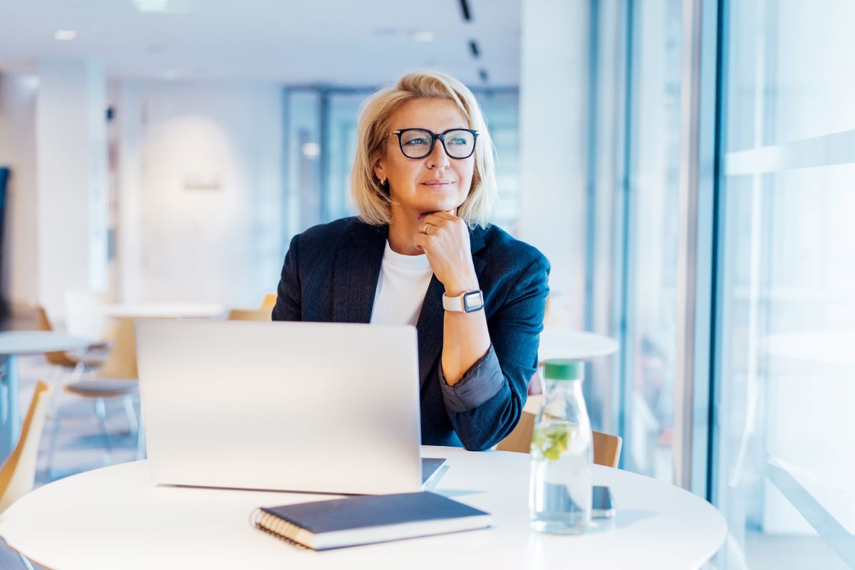 Women looking at the window of her office 