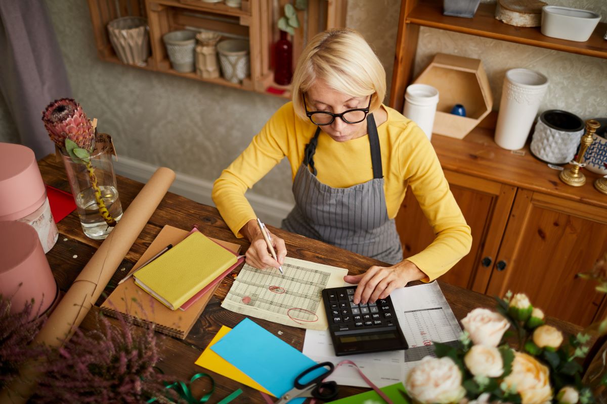 Female business owner reviewing financial documents 