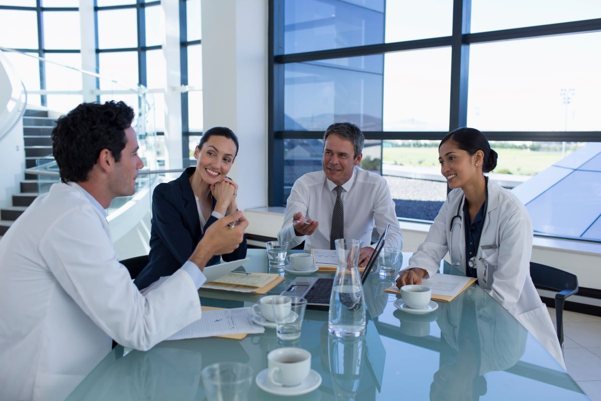 Group of doctors talking to administration 