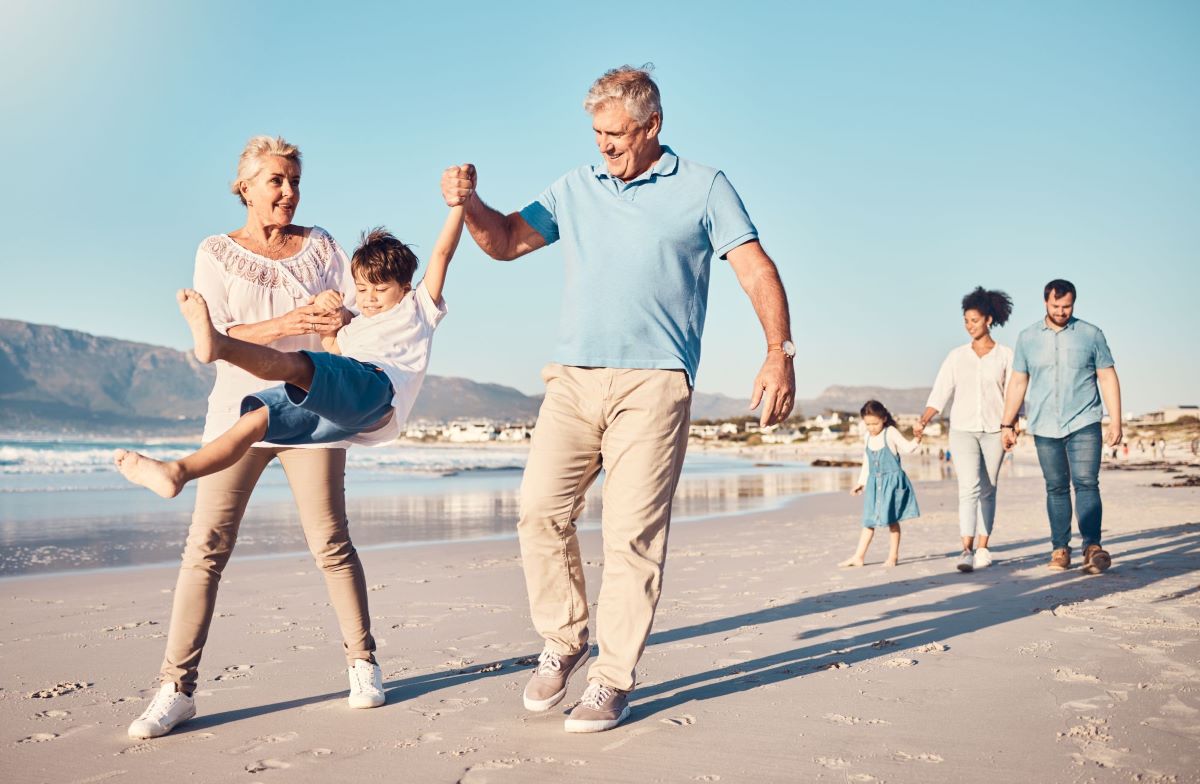 Intergenerational family having fun on a beach